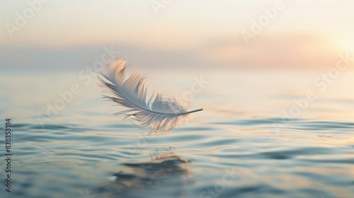 A single feather floating in the air, symbolizing lightness and the essence of freedom photo