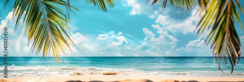 Beautiful summer background with blurred sandy beach and palm tree leaves on blue sky banner, panoramic banner with copy space for design text