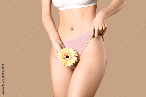 Young woman in panties with...