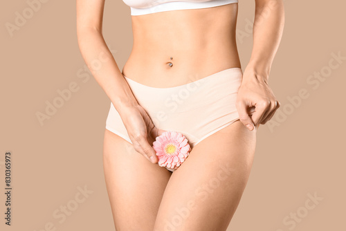 Young woman in panties with...