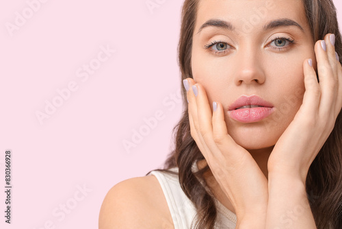 Beautiful young woman with ...