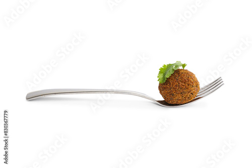 Fork with delicious falafel ball and parsley on white background photo