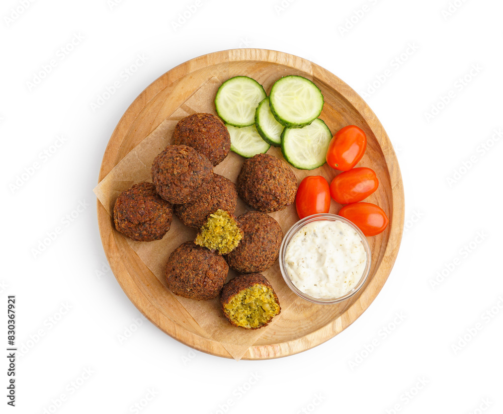 Wooden plate with delicious falafel balls, sauce and vegetables on white background Wooden plate with delicious falafel balls, sauce and vegetables on white background