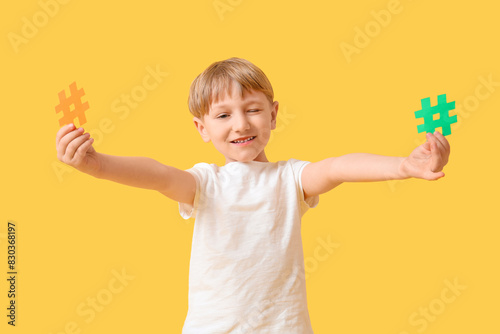 Cute little boy with hashta...