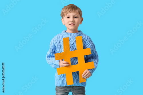 Cute little boy with hashta...