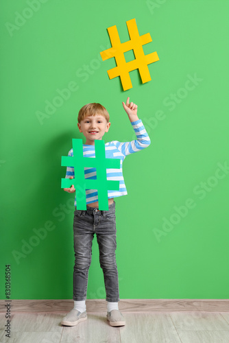 Cute little boy with hashta...