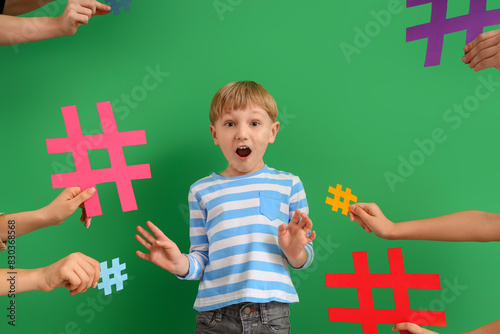 Surprised little boy surrou...