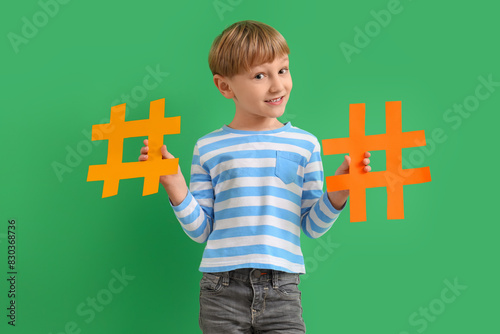 Cute little boy with hashta...