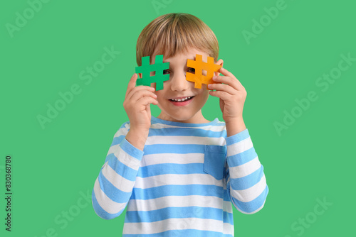 Cute little boy with hashta...