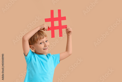 Cute little boy with hashta...