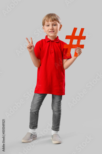Cute little boy with hashta...