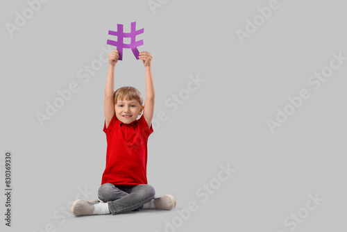 Cute little boy with hashta...