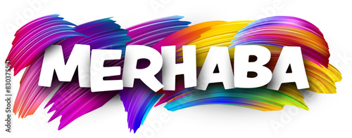 Hello at Turkish paper word sign with colorful spectrum paint brush strokes over white.