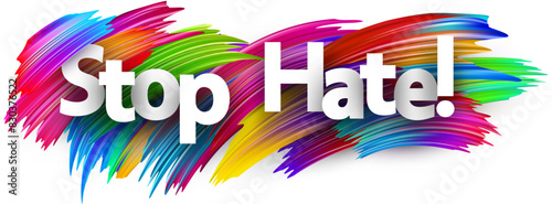 Stop hate paper word sign with colorful spectrum paint brush strokes over white.