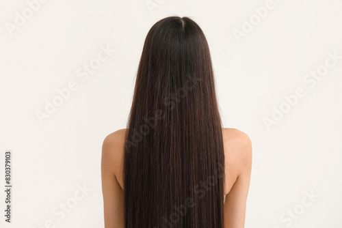 Young woman with long brown...