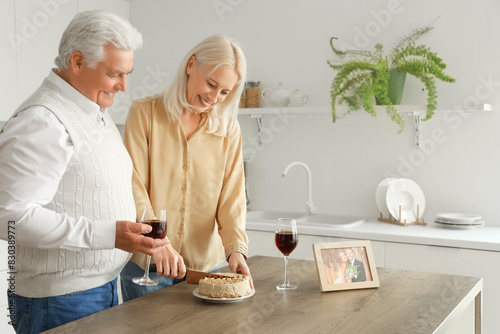 Mature couple with wine and...
