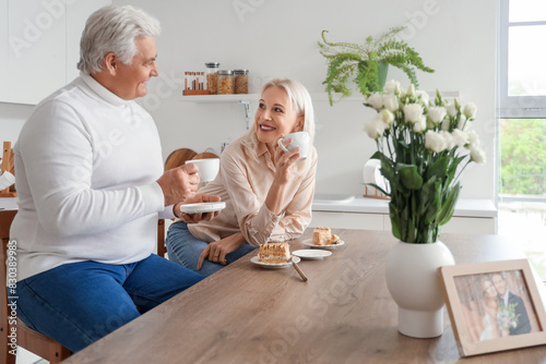 Mature couple with tea and ...