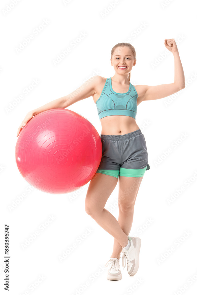 Sporty young woman with fitball showing muscles on white background Sporty young woman with fitball showing muscles on white background