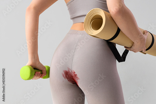 Sporty young woman in stain...