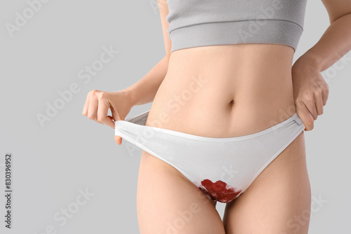 Menstruating woman in stain...