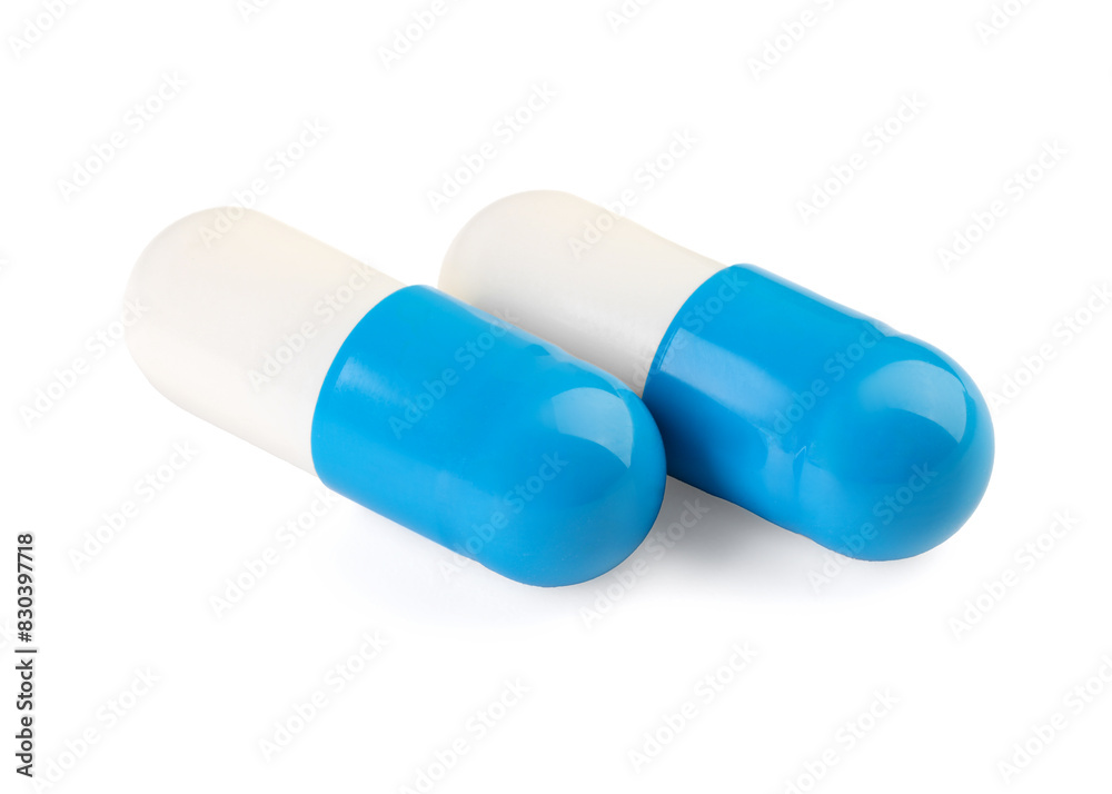 Two antibiotic pills isolated on white. Medicinal treatment Two antibiotic pills isolated on white. Medicinal treatment