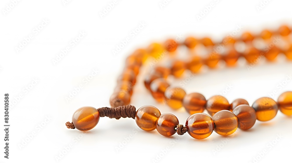 Closeup of tasbih or rosary on a white background. Selective focus and copy space. Closeup of tasbih or rosary on a white background. Selective focus and copy space.