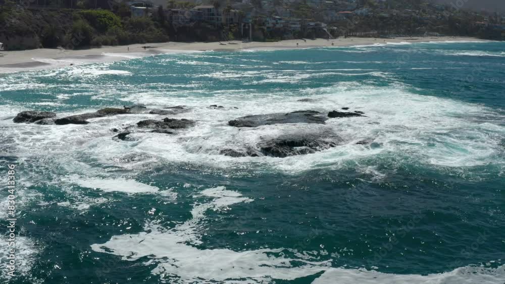 Aerial View of Ocean Waves Crashing on Rocks Off the Laguna Beach Coastline