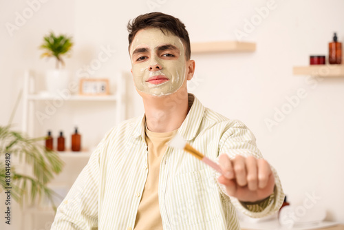 Young man with applied clay...