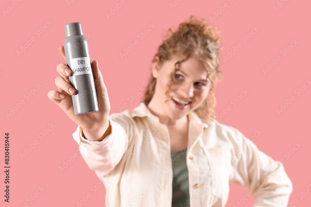 Young woman with dry shampoo on pink background, closeup Young woman with dry shampoo on pink background, closeup