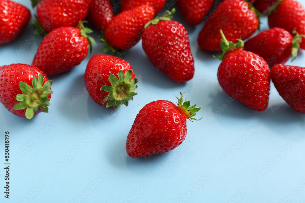 Sweet fresh strawberries on blue background Sweet fresh strawberries on blue background