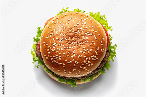 Top View of a Delicious Hamburger: A Perfectly Assembled Bun, Juicy Beef Patty, Fresh Tomatoes, Crisp Onions, Leafy Lettuce, and a Medley of Other Tasty Ingredients