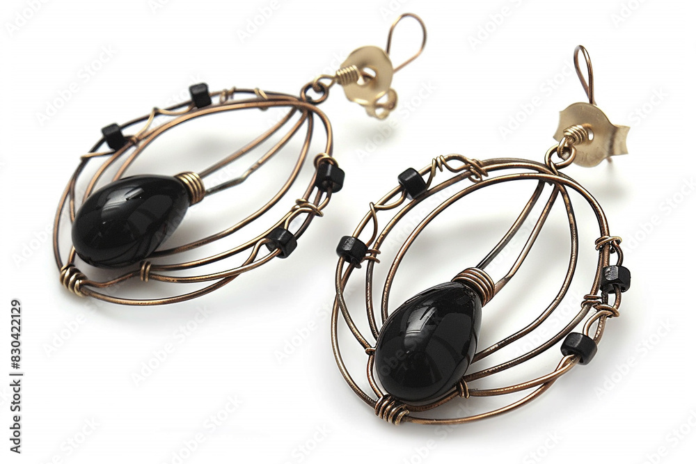 Wire earrings with black beads isolated on white background.