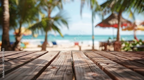 A wooden tabletop offering a tranquil view of the beach  with vibrant beach cafes gently blurred in the background.