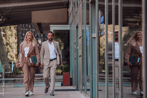 Modern business couple after a long day s work  walking together towards the comfort of their home  embodying the perfect blend of professional success and personal contentment.