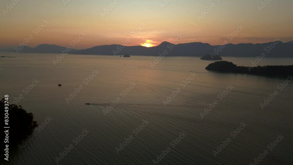 descending drone
. Majestic view of a sunrise behind mountains, casting warm hues over the calm sea. descending drone
. Majestic view of a sunrise behind mountains, casting warm hues over the calm sea.