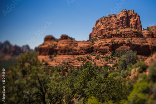 Desert mountain cliff tilt shift with deep blue sky