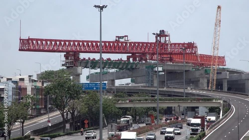 Bridge Girder Erection Machine for Highway construction above busy street. photo