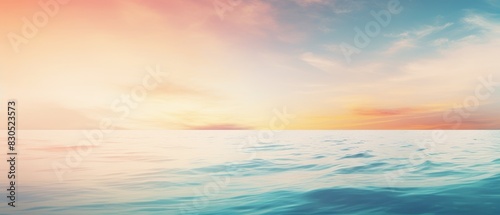 Peaceful seascape with soft pastel sky and calm waves.