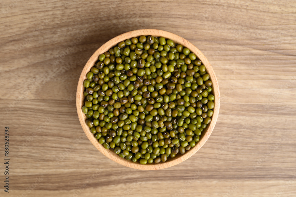 Organic mung bean seed in bowl on wooden background, Table top view Organic mung bean seed in bowl on wooden background, Table top view