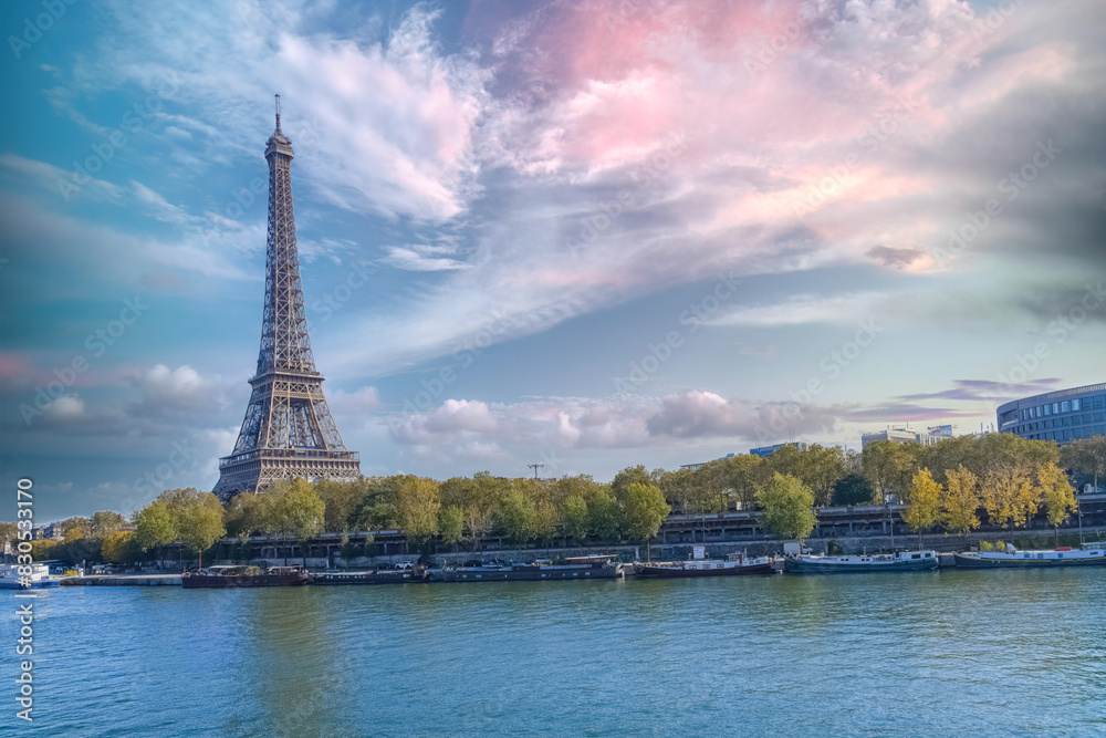 Paris, the Eiffel Tower in autumn, with sunset sky
