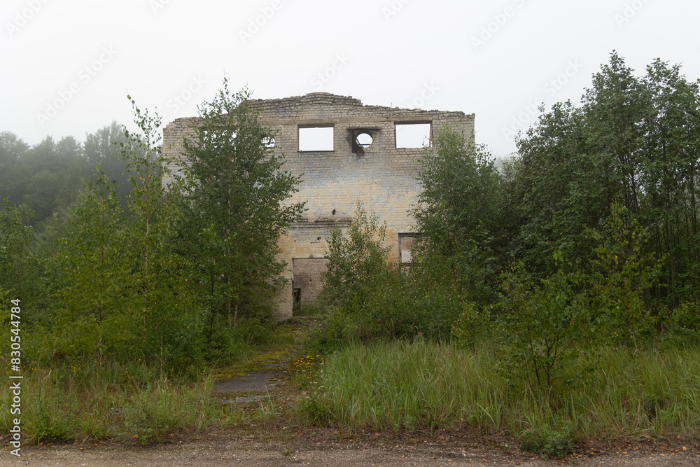 The ruins of building in old soviet army base in Latvia, Europe. Collapsed house. The ruins of building in old soviet army base in Latvia, Europe. Collapsed house.