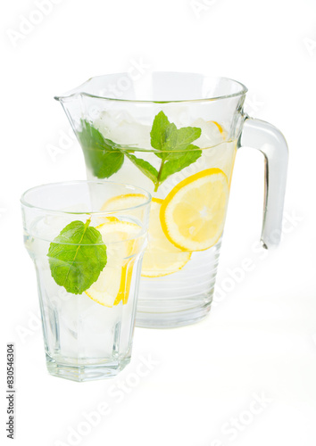 Water with lemon and mint on white background