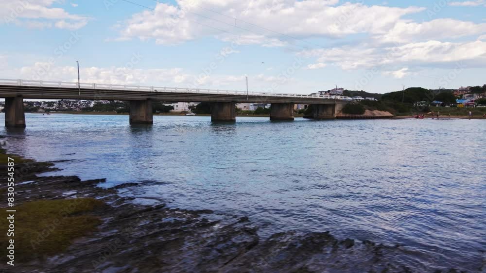Drone trucking riser reveals bridge in Stilbaai over Goukou estuarine river Drone trucking riser reveals bridge in Stilbaai over Goukou estuarine river