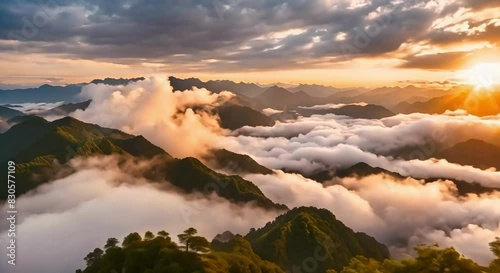 Billowing Clouds at Sunset Over the Undulating Mountains of Jiucaiping, Guizhou, China. Sunset Glow Enhances the Spectacular Scene as Clouds and Mists Roll and Relax Between the Peaks
 photo