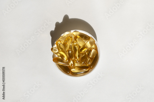 Obraz na płótnie vitamin D capsules on a light background.