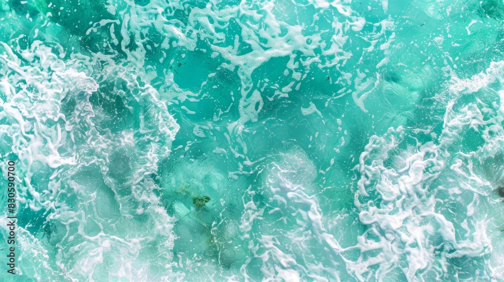 Fototapeta premium a wave advances toward the shore; a person is stationed midway, feet submerged