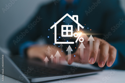 Real estate investment concept. Man touch virtual house icon for analyzing mortgage loan home and insurance real property mortgage. interest rate, Investment planning, business real estate. photo