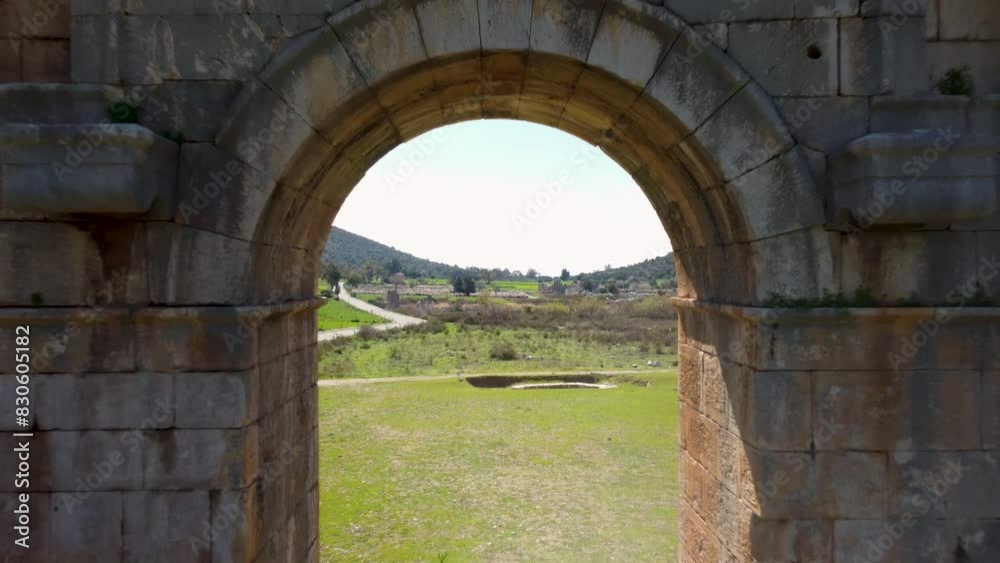 Gates to Patara on the Turkish coast. Former capital city of Lycia. Featuring large amphitheatres, arched gates, and beach access. A historical site rich in cultural heritage. Patara, Turkey - Türkiye Gates to Patara on the Turkish coast. Former capital city of Lycia. Featuring large amphitheatres, arched gates, and beach access. A historical site rich in cultural heritage. Patara, Turkey - Türkiye