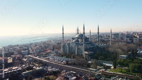 Iconic Blue Mosque in Istanbul, Turkey, with its majestic domes, minarets, surrounded by the cityscape and historic landmarks. Aerial drone footage, Istanbul, Turkey - İstanbul, Türkiye photo