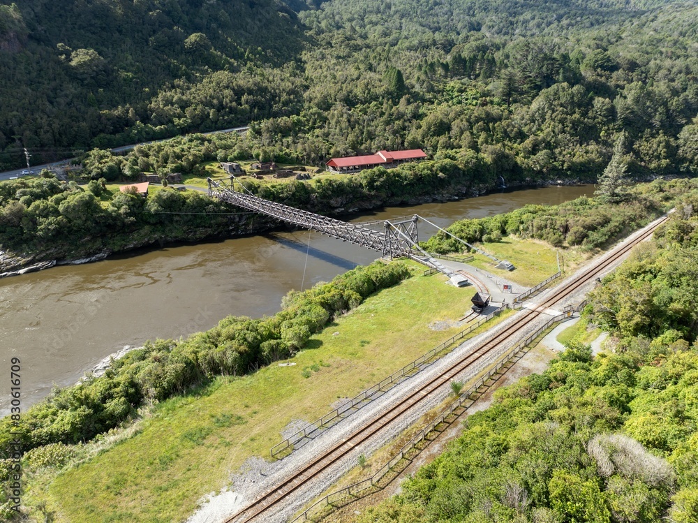 Bridge crossing the grey river at the abandoned historic Brunner Mine, Greymouth, West Coast, New Zealand. Bridge crossing the grey river at the abandoned historic Brunner Mine, Greymouth, West Coast, New Zealand.